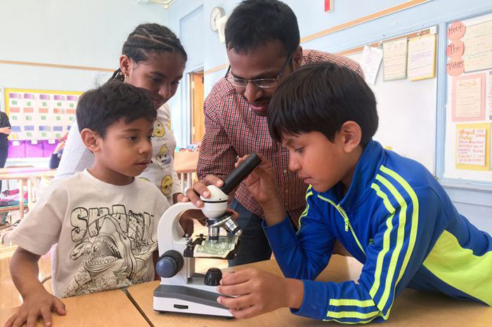 Santosh Peddi with elementary school students