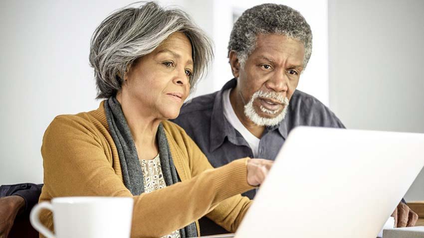 Older couple using computer