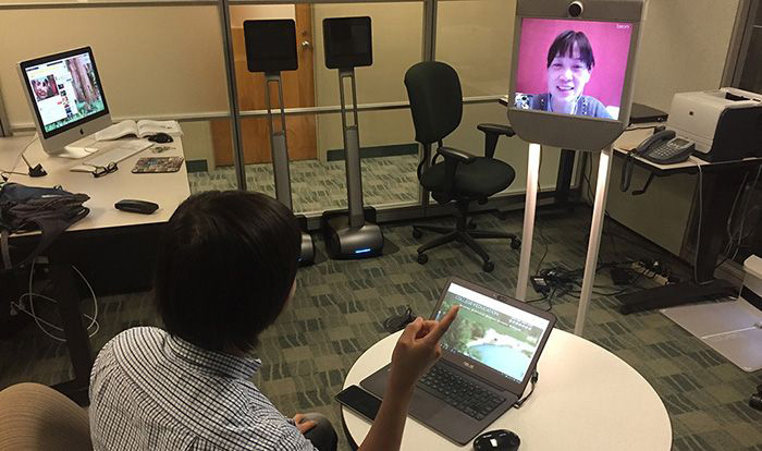 Robot technology helps elementary school student attend class.