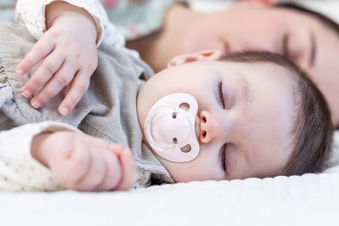 Mom co-sleeping with baby