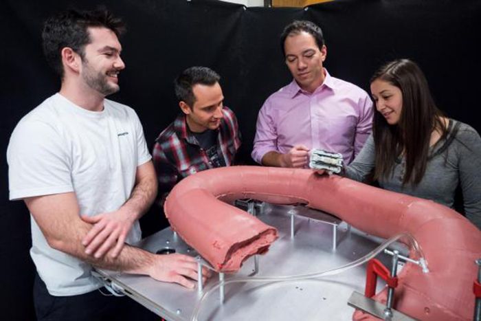 Associate Professor Mark Rentschler with graduate students Levi Pearson, Greg Formosa and Kristin Calahan