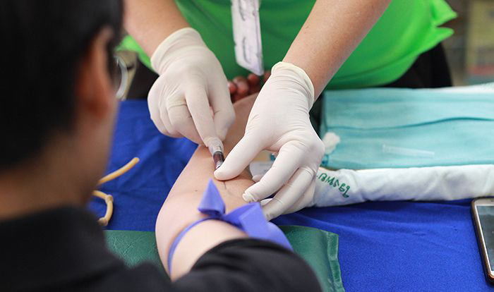Image: Health professional drawing blood