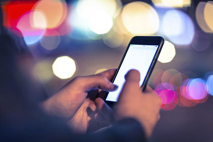 Image of man using cellphone