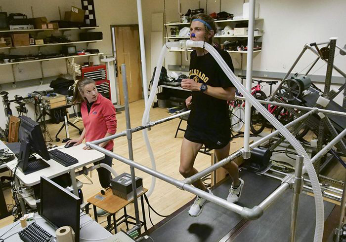 Shalaya Kipp, left, conducts a treadmill study of the 4% shoe.