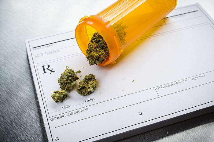 Image of pill bottle with marijuana