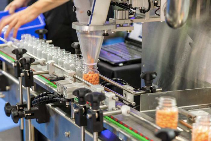 Opioid pills on conveyor belt