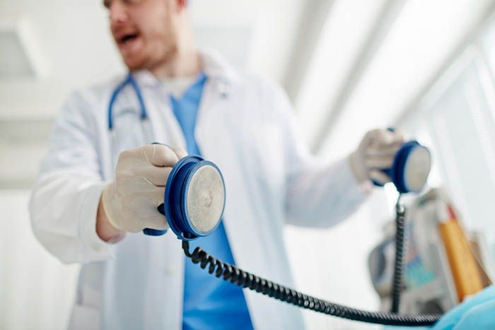 Photo of physician with defibulator