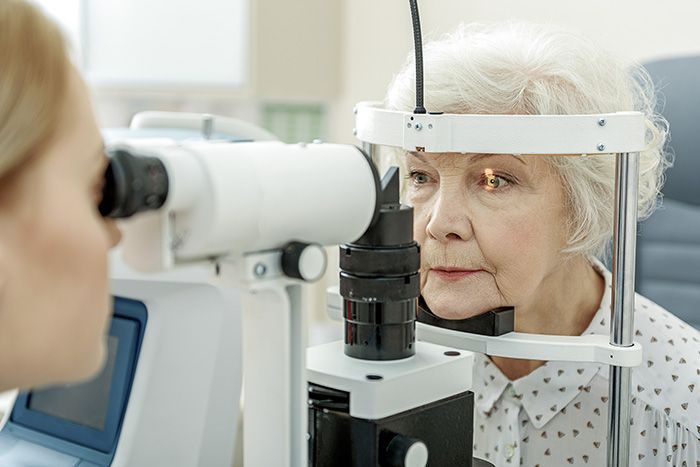 Doctor giving patient an eye exam