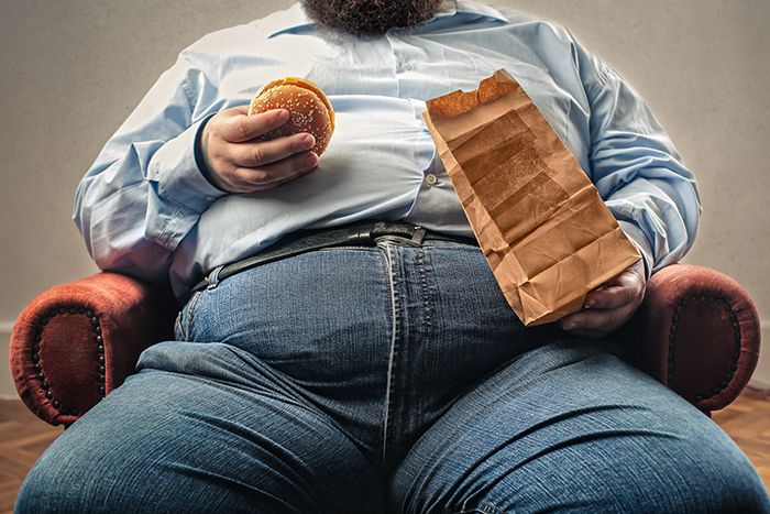 Man with cheeseburger