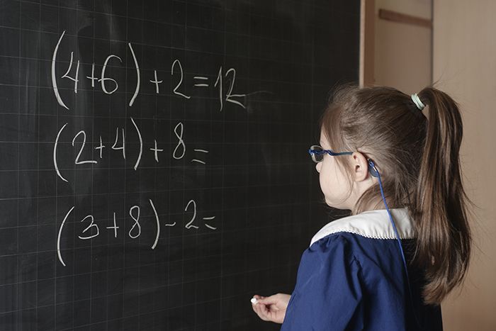 First grader solving a math problem