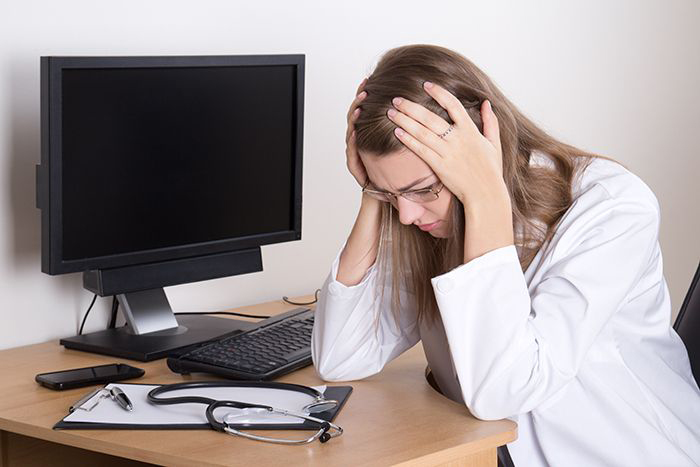 Woman doctor at her desk