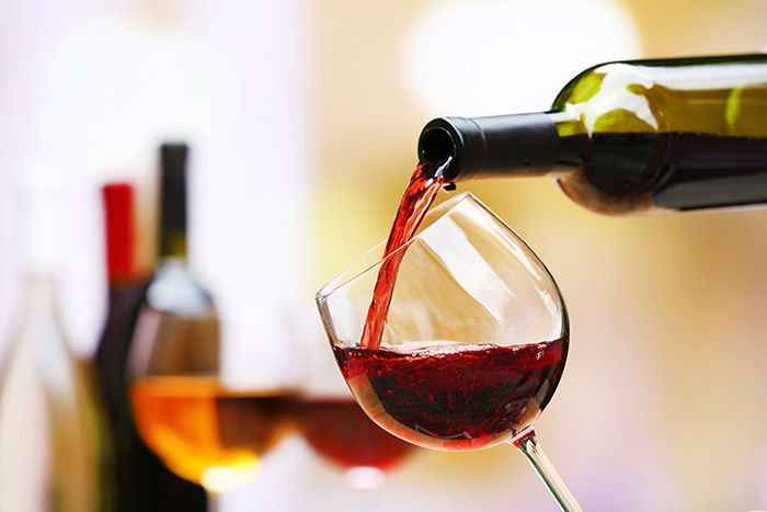 Wine being poured into a glass