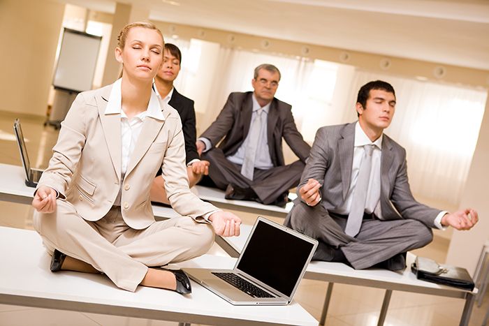 Employees practicing yoga