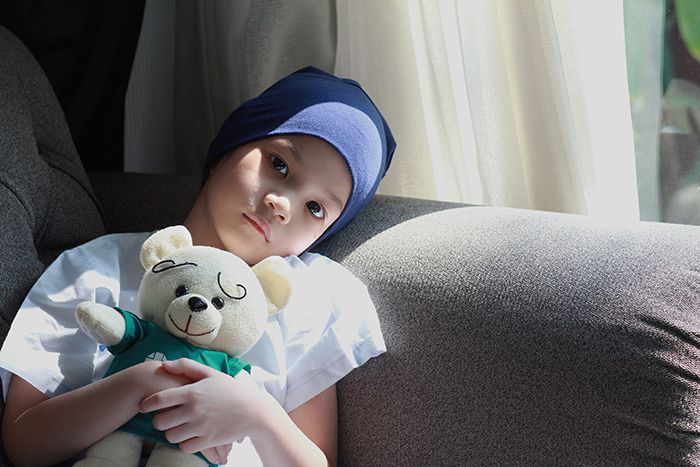 Images of child with scarf on her head