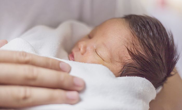 Mother holding newborn