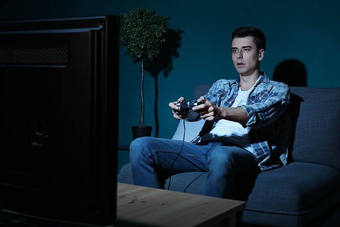 Young man playing video games