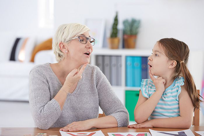 Speech therapist works with a child