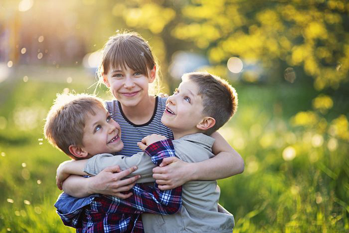 Siblings hugging