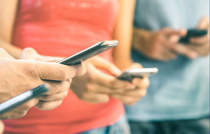 Users accessing social media on their phones