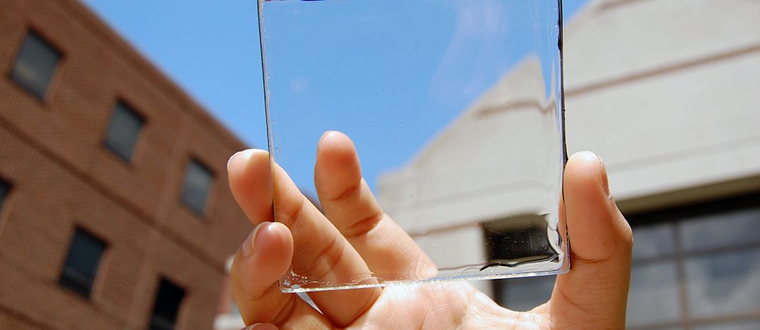 Hand holding transparent solar cell
