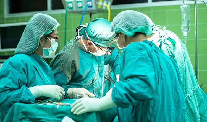 Doctors performing surgery