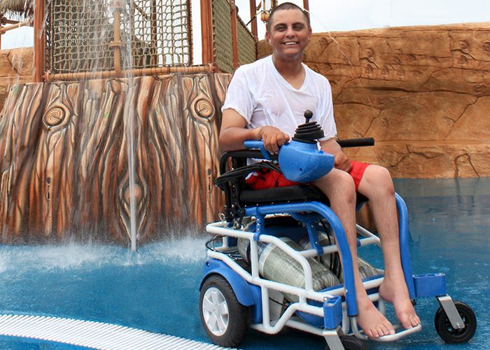 Mark Villanueva, a Morgan’s Inspiration Island employee, trying out the PneuChair.