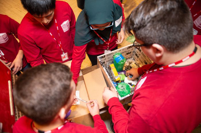 Iowa State University students pack their disaster relief container