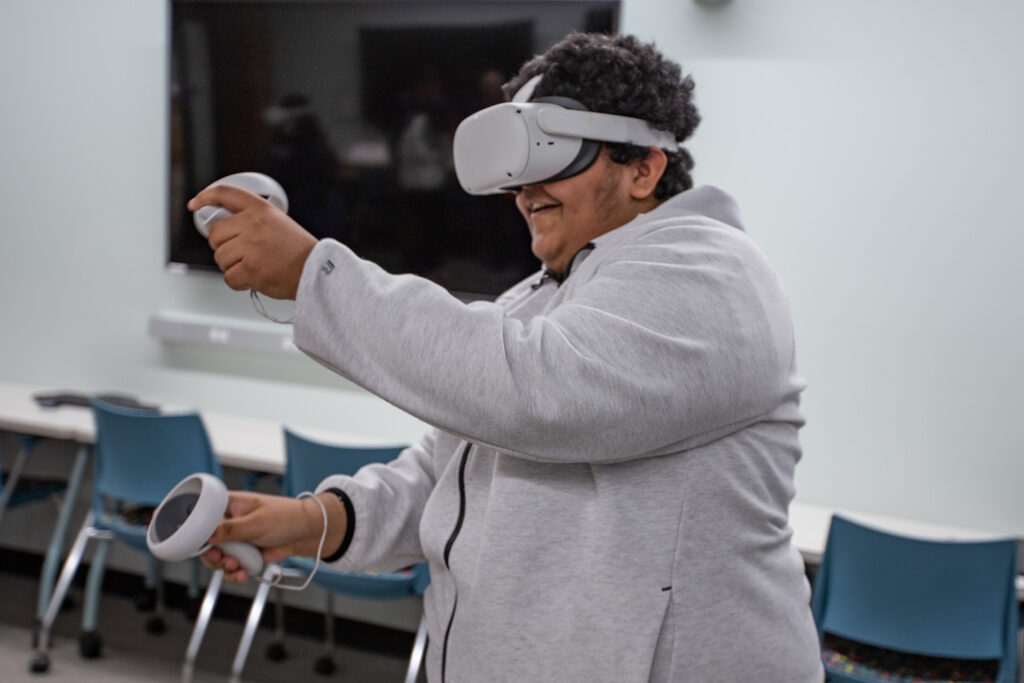 "It Makes Us Feel Powerful: Unlocking Virtual-Reality's Potential for People With Autism; At a tech camp for young autistic people on the UF campus, Christian Cartagena tries a virtual reality job simulator."