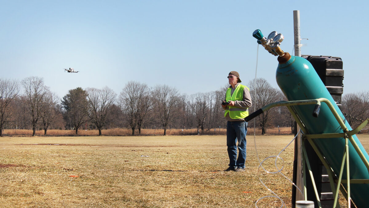 "Using drones and lasers, researchers pinpoint greenhouse gas leaks; Co-author Lars Wendt operates the drone during field experiments. (Photo courtesy of the researchers)"