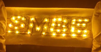 "Wear and forget: an ultrasoft material for on-skin health devices; Lights connected using the new liquid metal elastomer composite illuminate the logo of the research group. Yadong Xu/University of Missouri"
