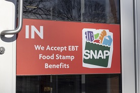 Photo of a door with a sign for SNAP