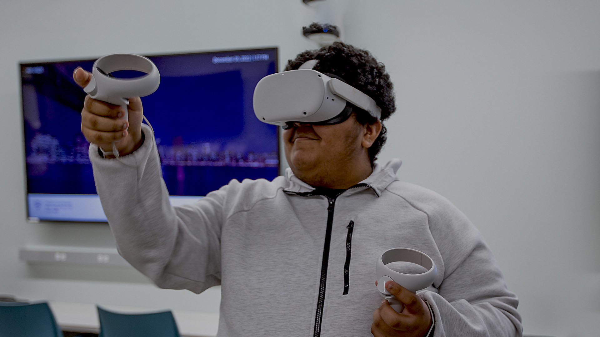 It Makes Us Feel Powerful: Unlocking Virtual-Reality's Potential for People With Autism; At a tech camp for young autistic people on the UF campus, Christian Cartagena tries a virtual reality job simulator.