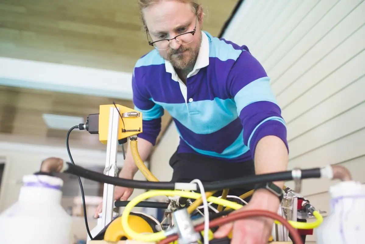 Custom-made Robots Could Build Concrete Structures Underwater; Photo: Guarini PhD student Samuel Lensgraf is working with the Dartmouth Reality and Robotics Lab on a mobile robot that can move heavy blocks for construction projects on the ocean floor"