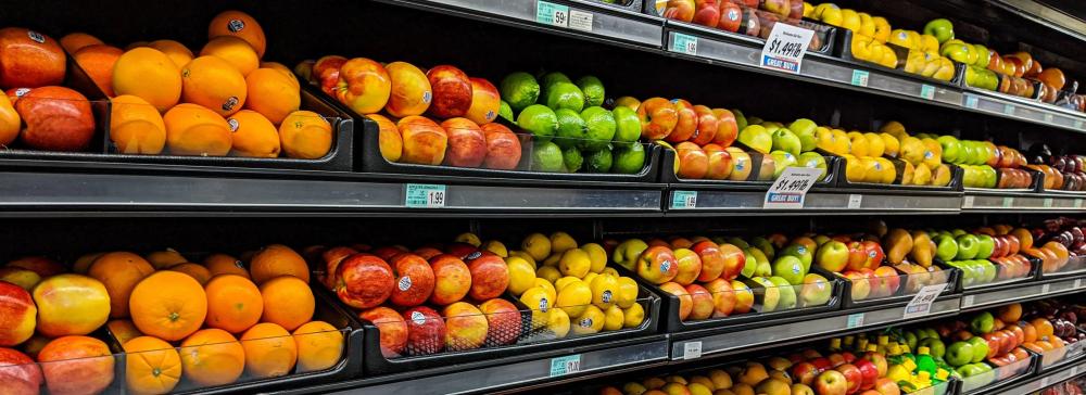 "Developing More Resilient Food Systems; Picture of fruits at a grocery store."