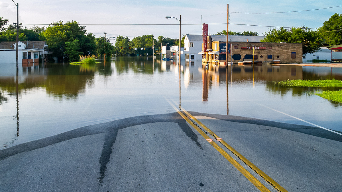 Carolina Researchers Examine New Construction in Floodplains; Photo of a flooded small town intersection