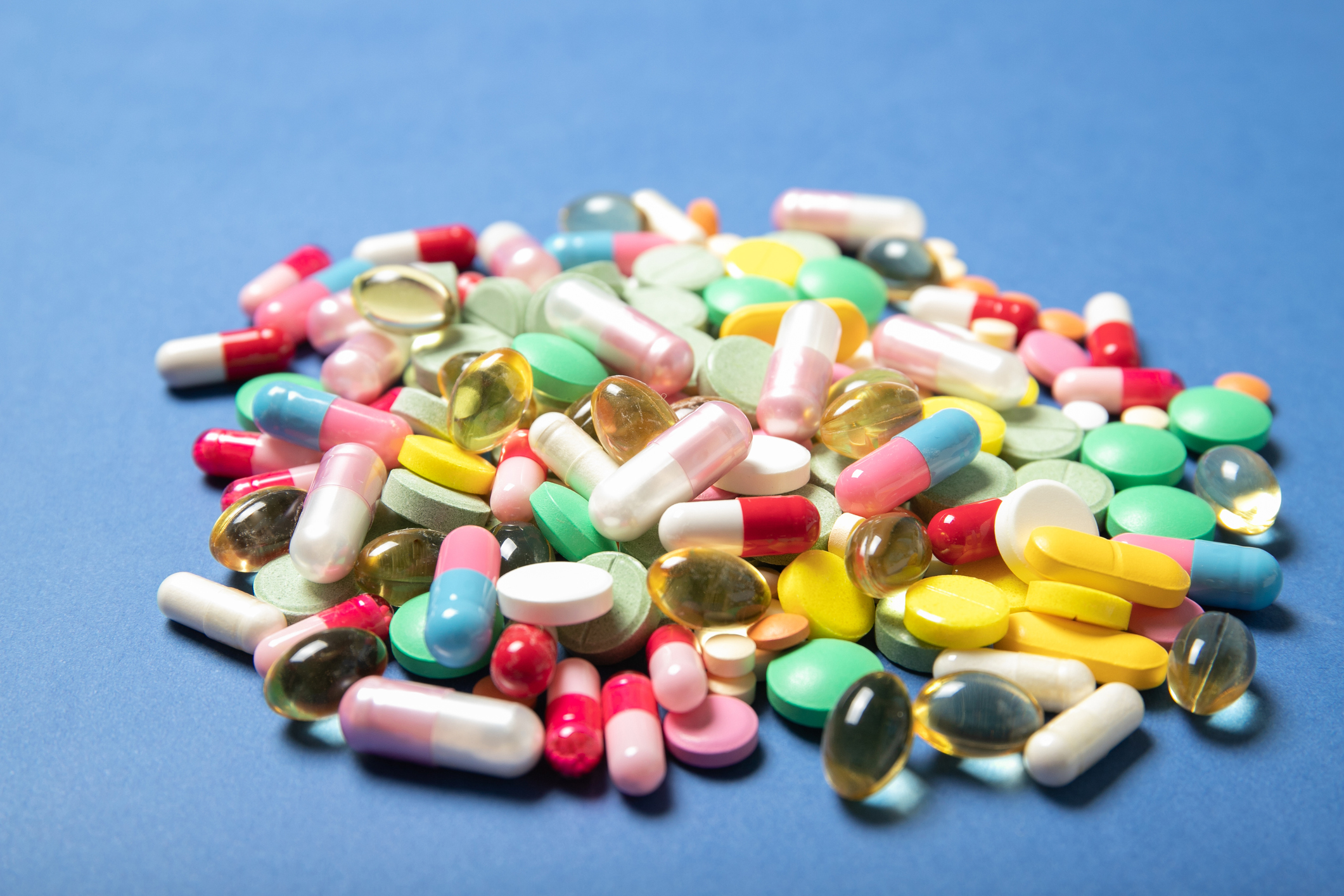 "Too Many Medications Leads to Adversity for Older Cancer Patients, According to New Study; Stock image of pills strewn on table