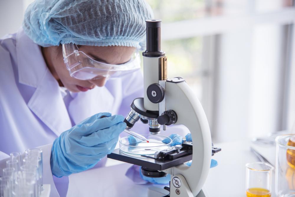How One Doctor-Patient Relationship Could Change How Women Are Treated for Gynecologic Cancers; "Stock photo of woman using microscope"