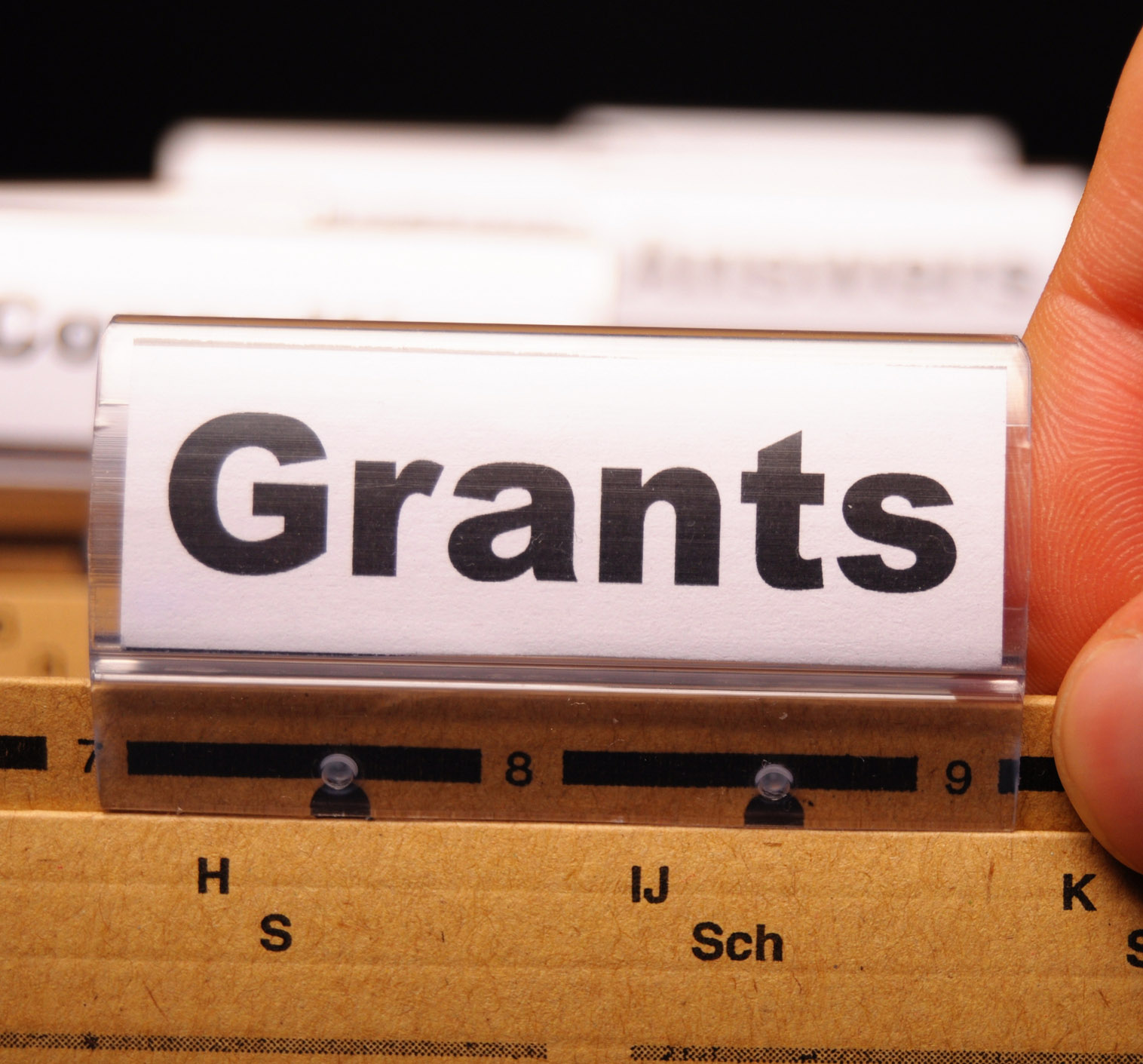 Tag on a folder in a group of files which reads "grants"
