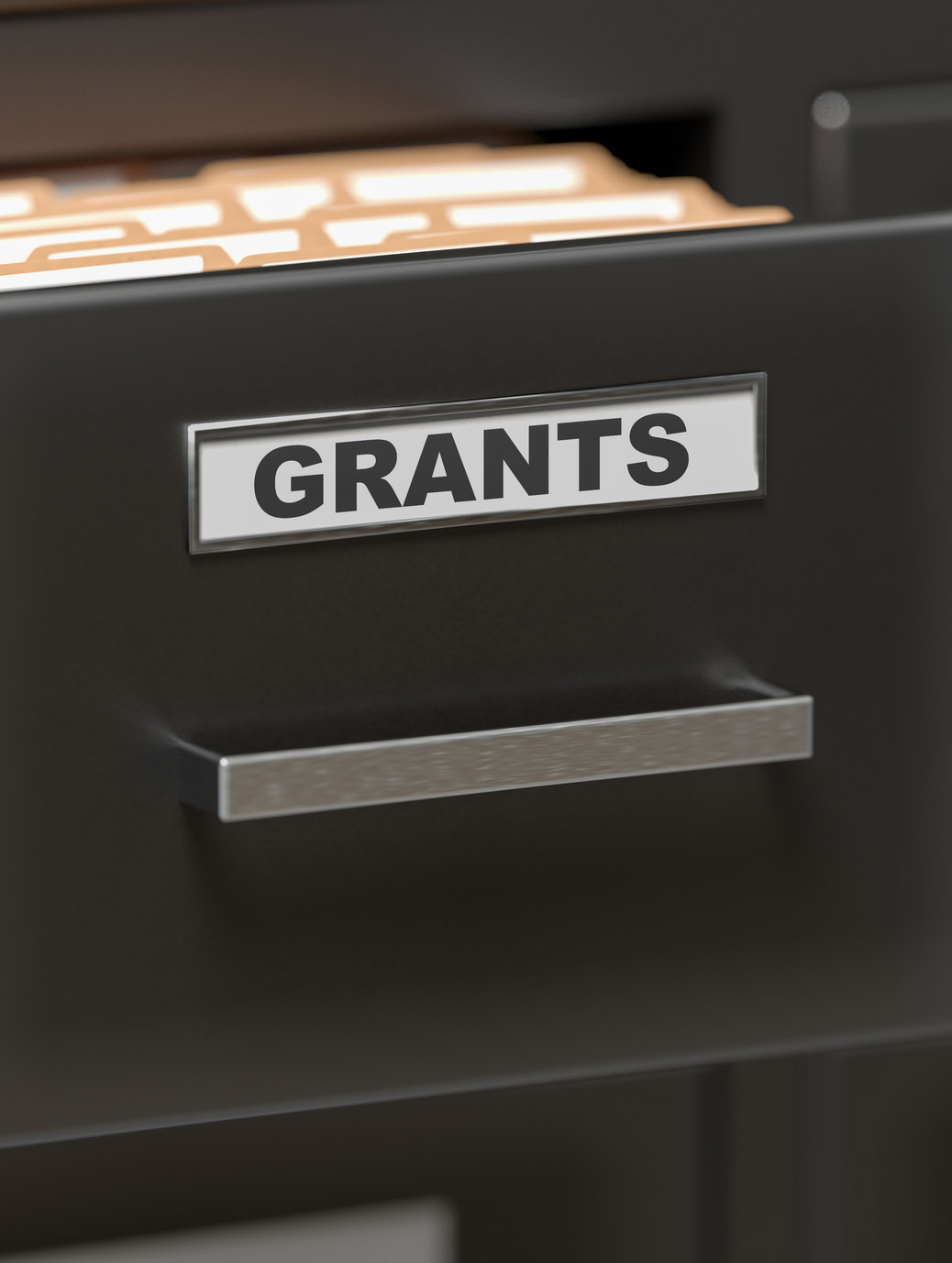 Black filing cabinet with a label that reads grants next to the handle