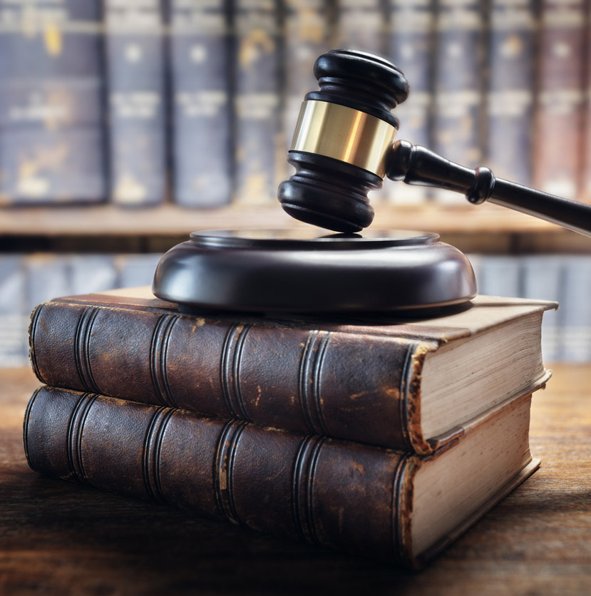 Judge's gavel on top of a stack of law books