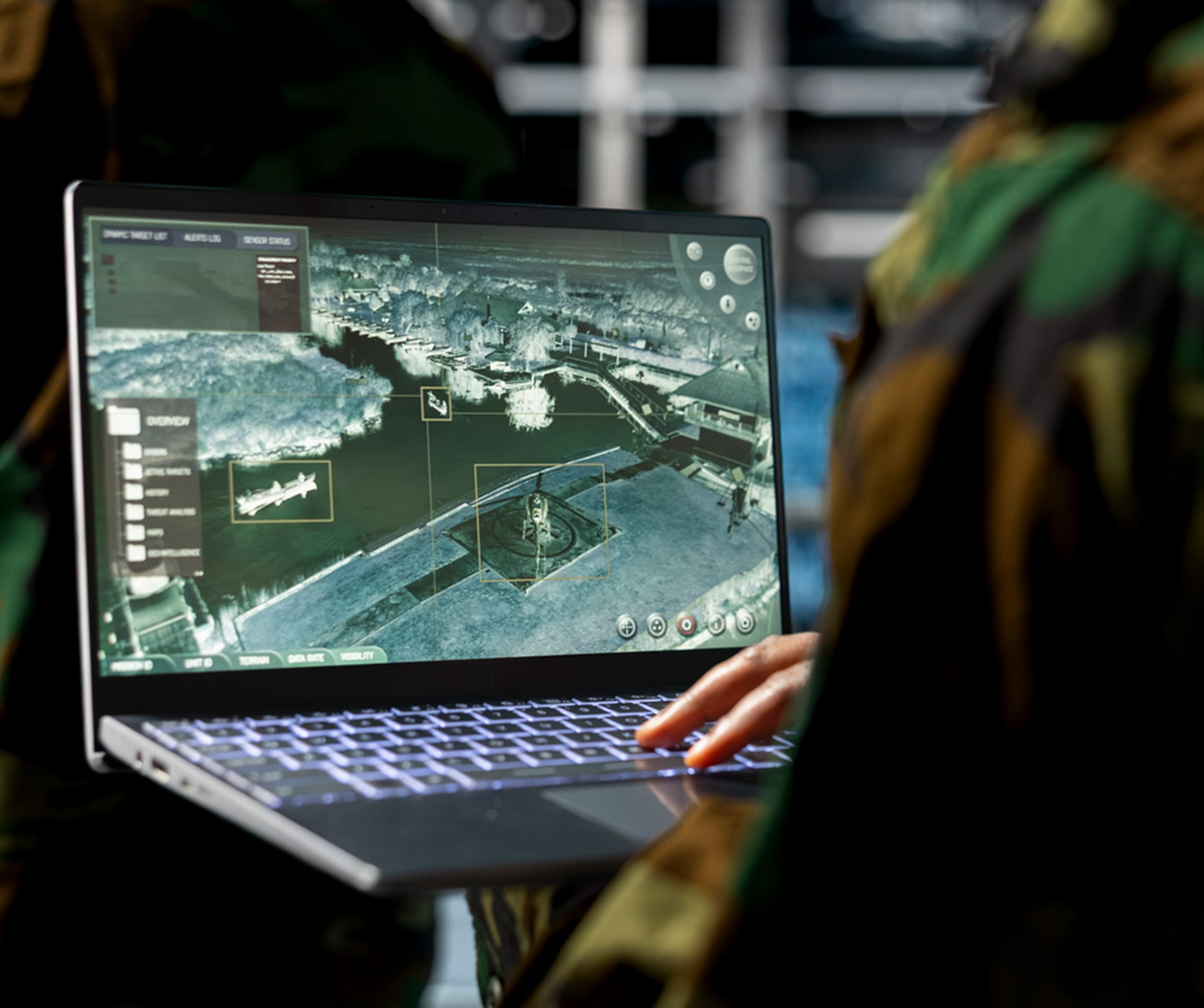 Military technician using AI on a laptop