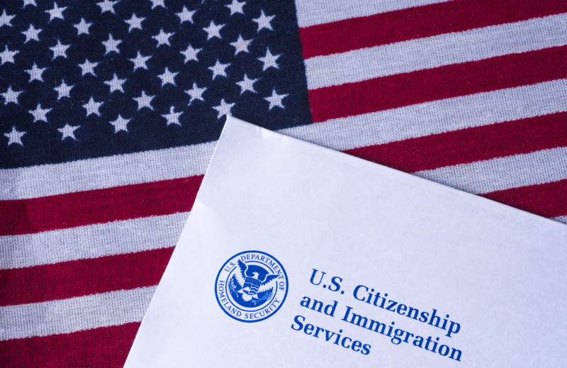 U.S. Citizens and Immigration Service on a flag