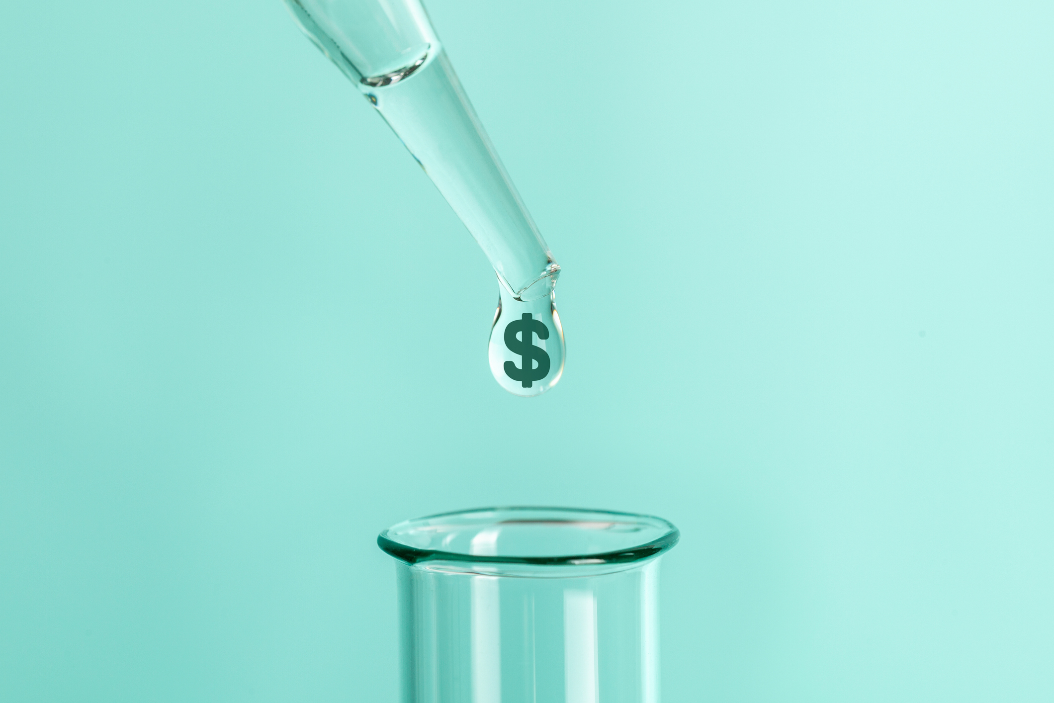 A drop falls from a pipette into a testtube; the drop contains a dollar sign.