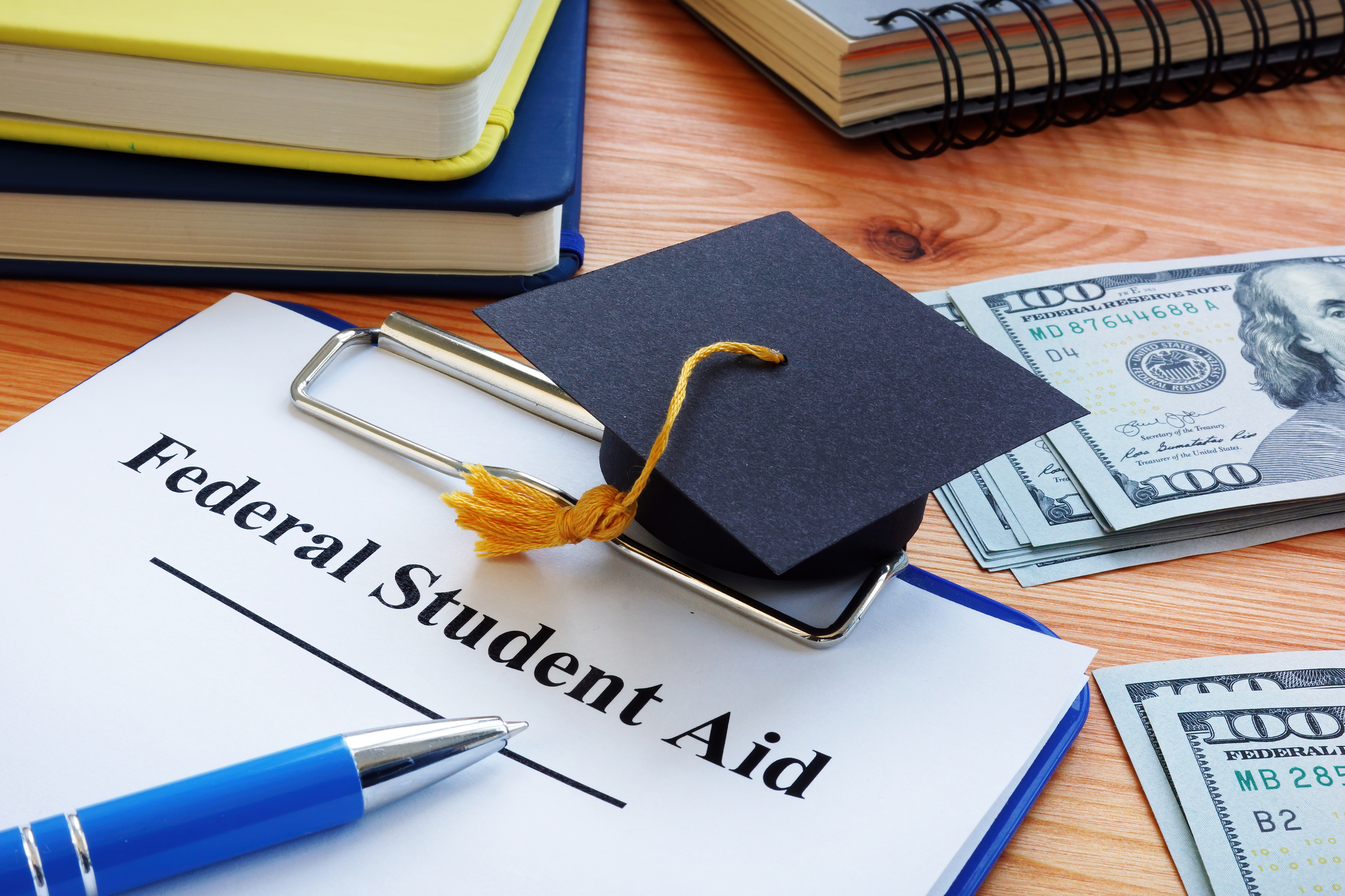A sheet of paper in a clipboard with the words "Federal Student Aid."