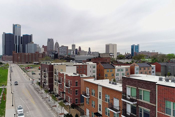 Harvard and the University of Michigan have formed two partnerships designed to encourage economic opportunity in Detroit and to fight the national scourge of opioid addiction.