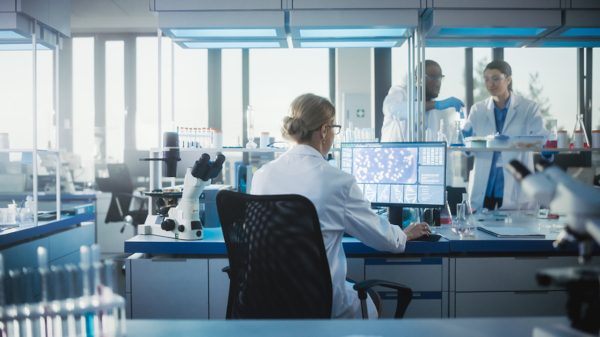 Medical Laboratory with Team of Scientists Working