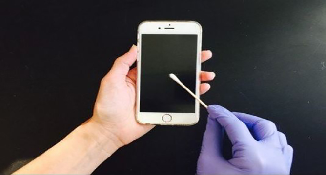 Photo - swabbing a phone