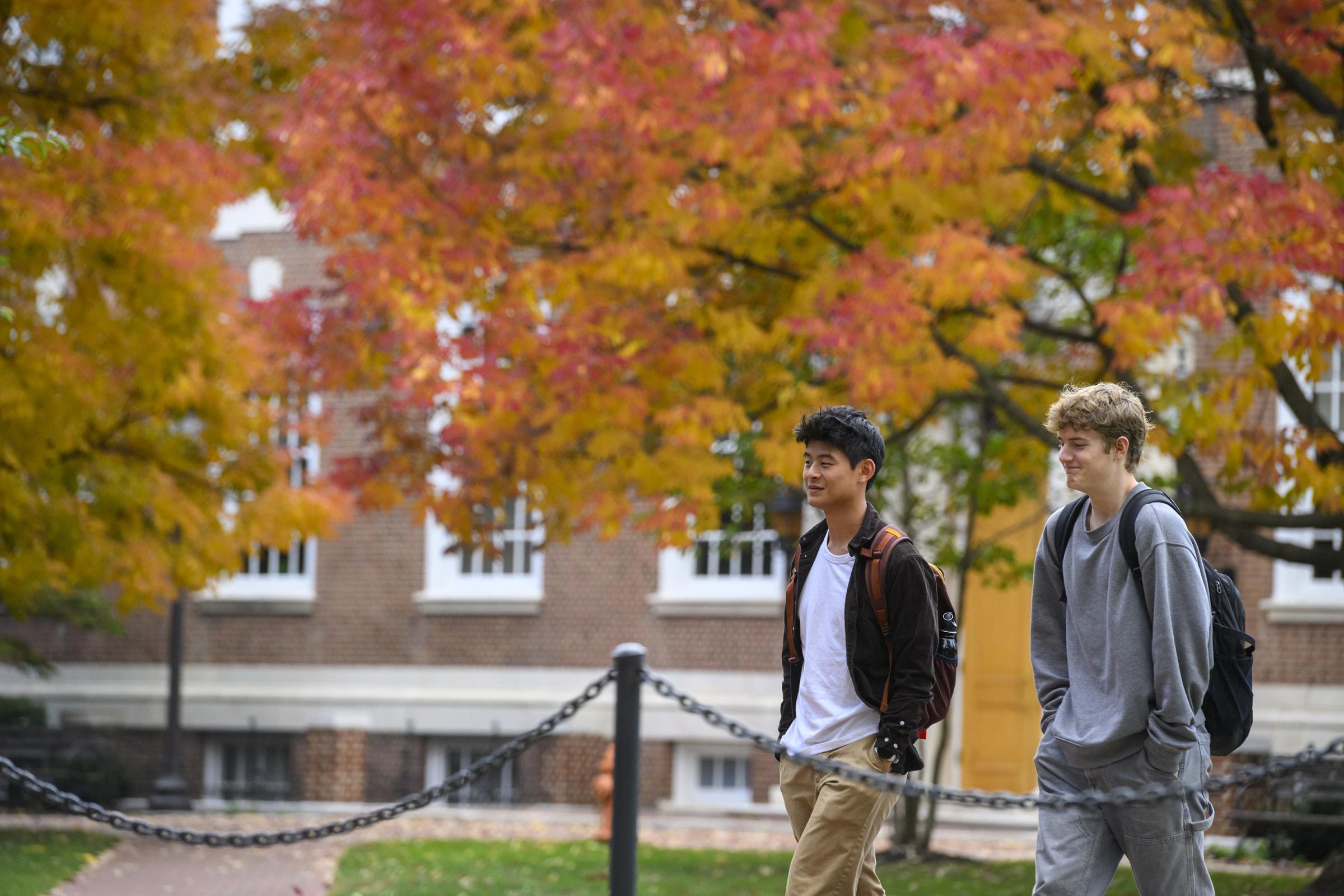 Students walking on the Johns Hopkins campus in autumn