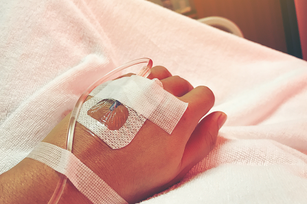 IV in hand, delivering a dose of blood thinners