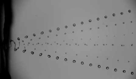 Aerosols emerge from the nozzle of an unelectrified, gas-focused whipping jet.